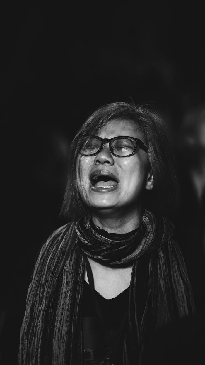 Portrait of a woman weeping in worship